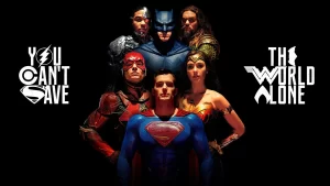 A picture of the Justice League (Superman in front, Flash and Wonder Woman behind him, and Cyborg, Batman, and Aquaman in the back row. The text on the image reades: "You Can't Save The World Alone." The Superhero logos are used for soem of the letters. The Flash symbol for the O in You, the Cyborg symbol for the C in Can't, the Superman S for the S in Save, the batarang for the E in The, the Wonder Woman W for the W in World, and Aquaman's symbol for the A in Alone.